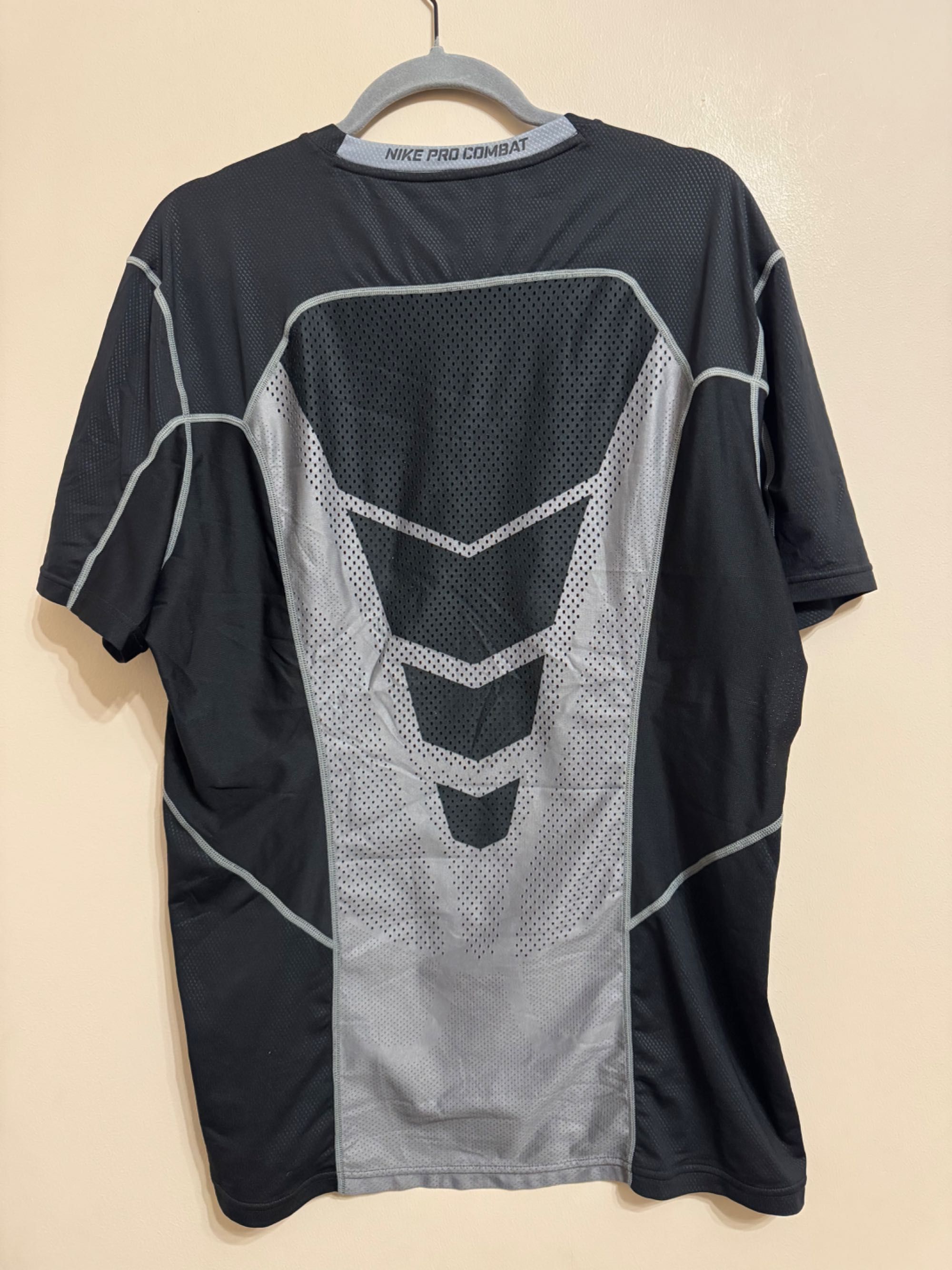 Nike Pro Combat Hypercool Fitted.          Nike Swoosh Tour Center.