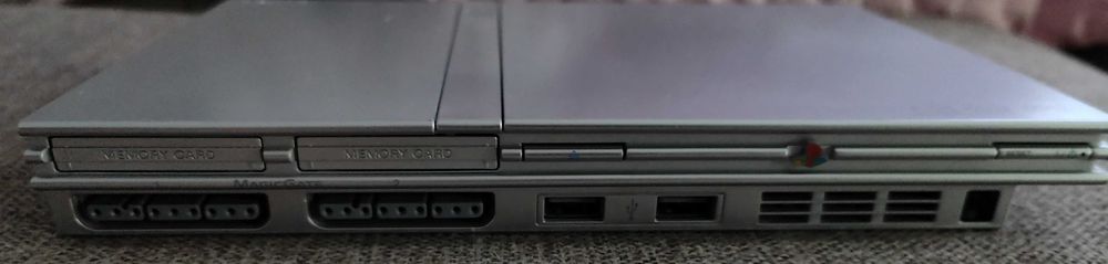 PlayStation 2 slim model deosebit argintiu modat 33 jocuri,maneta