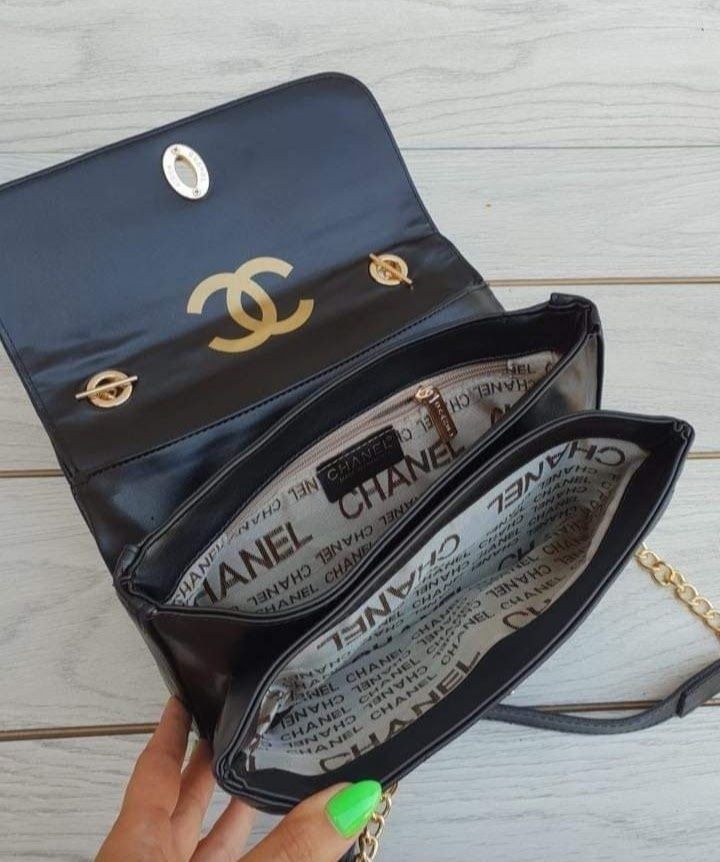 Geanta damă cu maner, logo metalic,două compartimente,saculet,eticheta