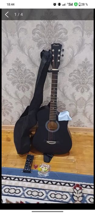 Гитара 1 ақ ай ысталған