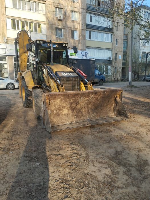Услуги экскаватора-погрузчика