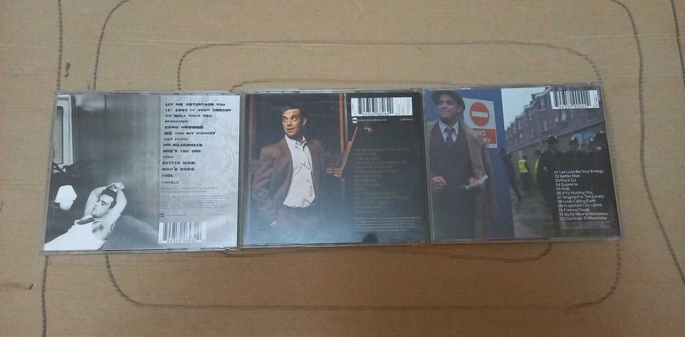 CD на Robbie Williams.