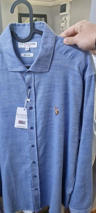 Продам 2 рубашки  мужские новые с бирками оригинал