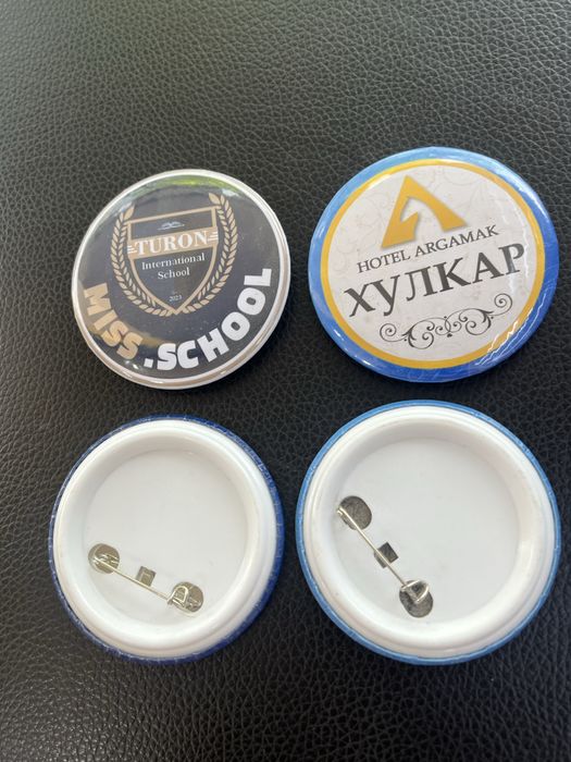 Logotipli va rasmli znachok Значок с булафкой