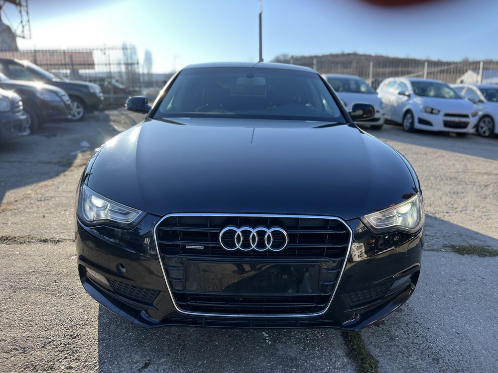 Audi A5 2.0TDI spotrback Quattro .