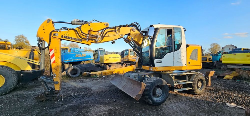Liebherr A 914 Excavator pe roți Compact, lamă, cale