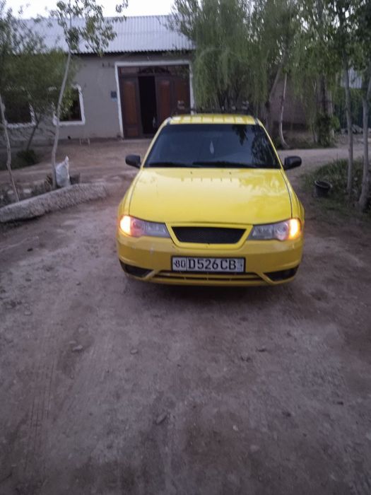 Nexia 2  2010yil sonstramblyor rangi sariq