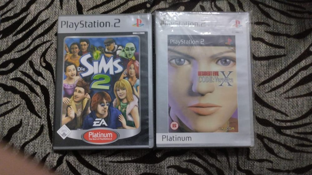 Продам лицензия Ps2 resident evil, sims 2