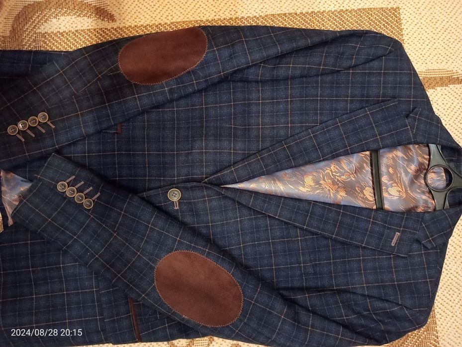 Продам новый пиджак 46 размер