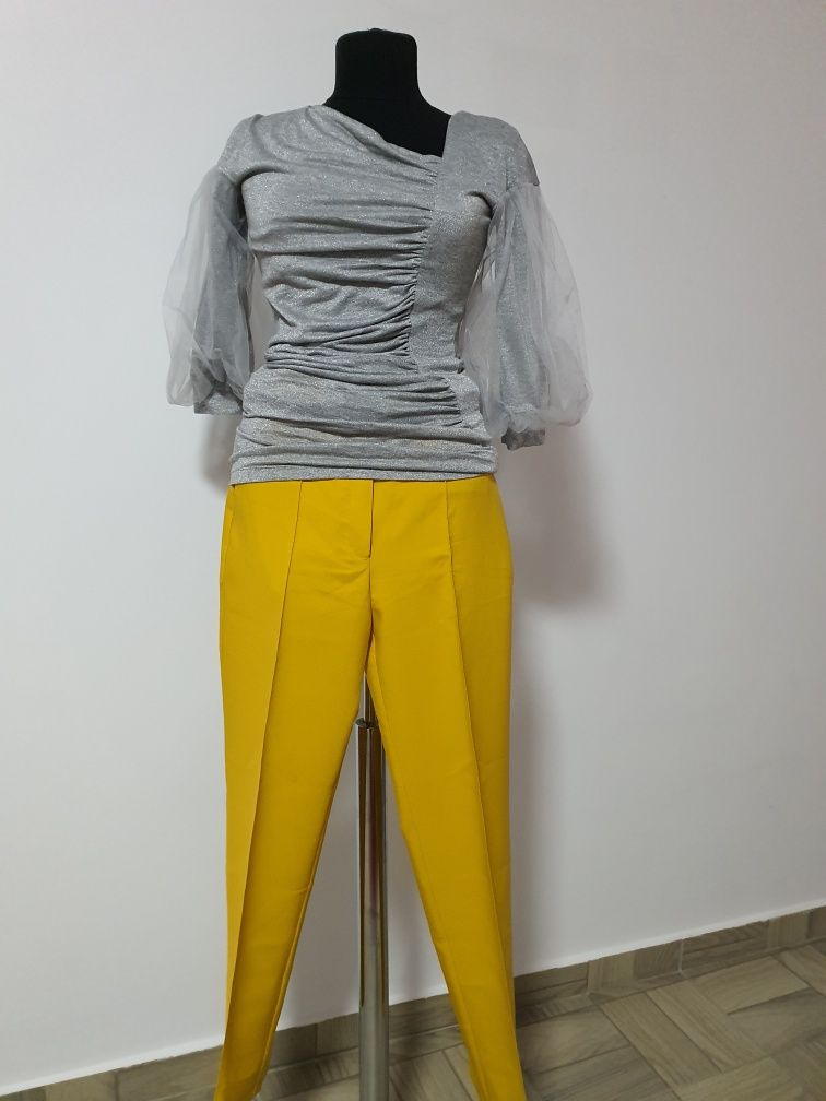 Pantaloni model ocru cu buzunare pentru ținute elegante sau casual