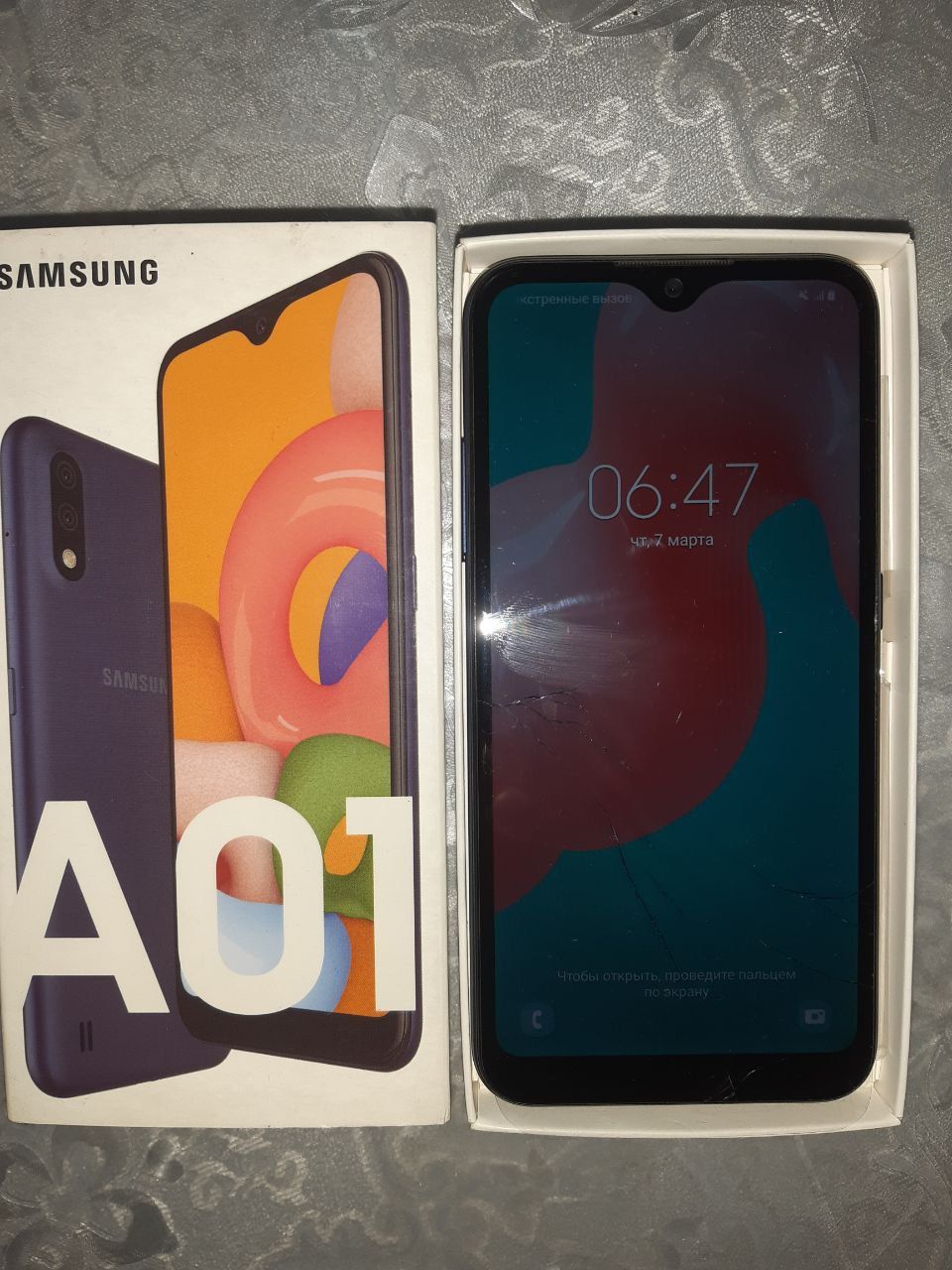 Samsung A01 hotira 32 holati yahshi ekrani usti shishasida singan ishl