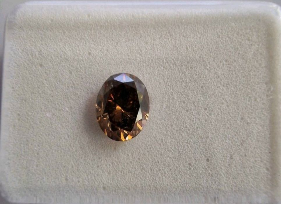 Diamant 0.5 Ct oval Fancy Maroniu Portocaliu închis