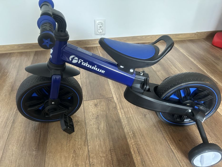 Tricicleta multifuctionala cu roti ajutatoare