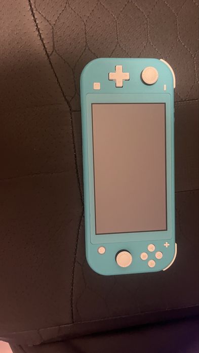 Nintendo Switch Lite + Joc + Husa calatorie