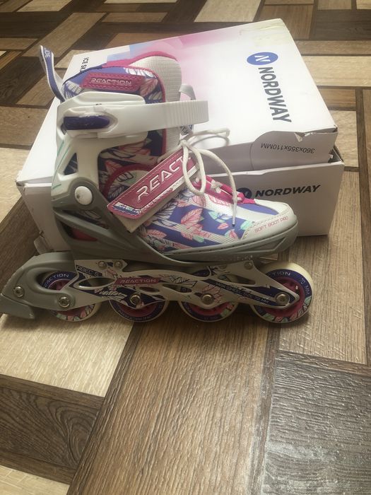 Роликовые коньки