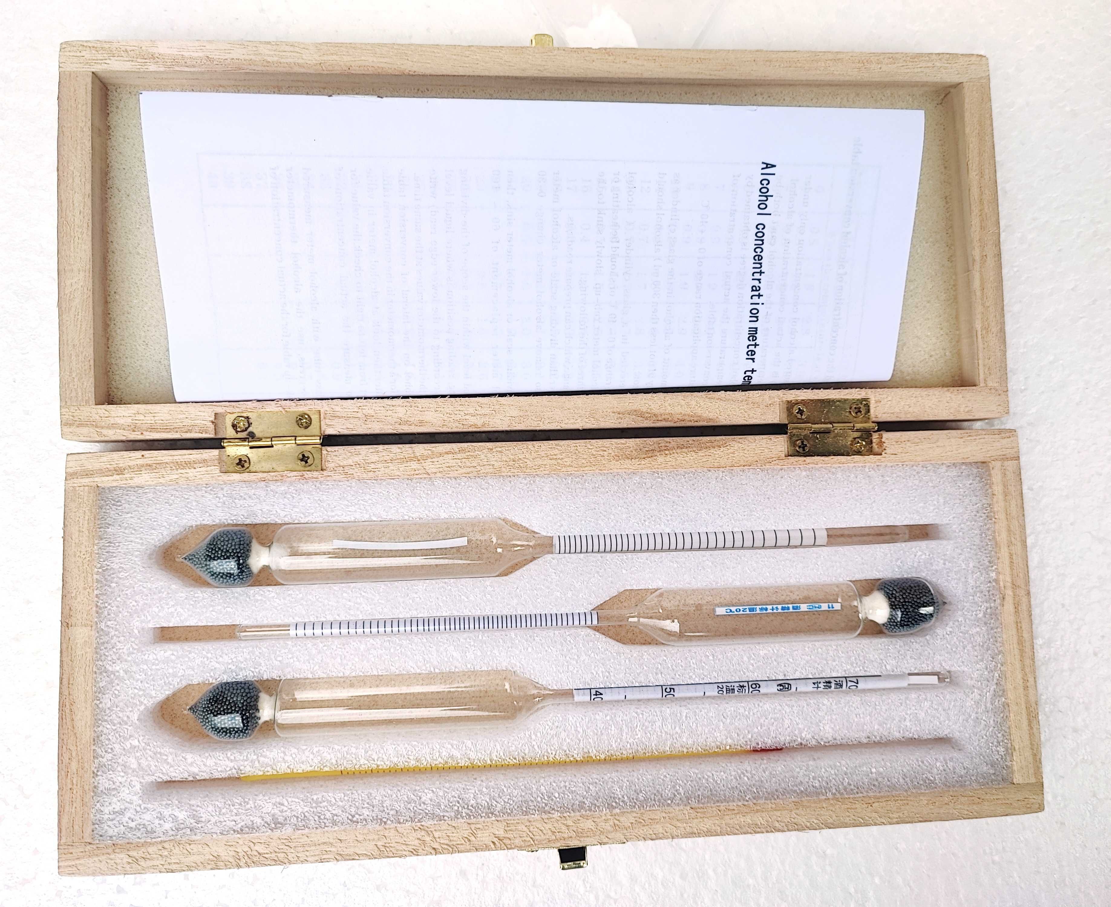 Прецизен спиртомер в дървена кутия, мензура, термометър и таблица