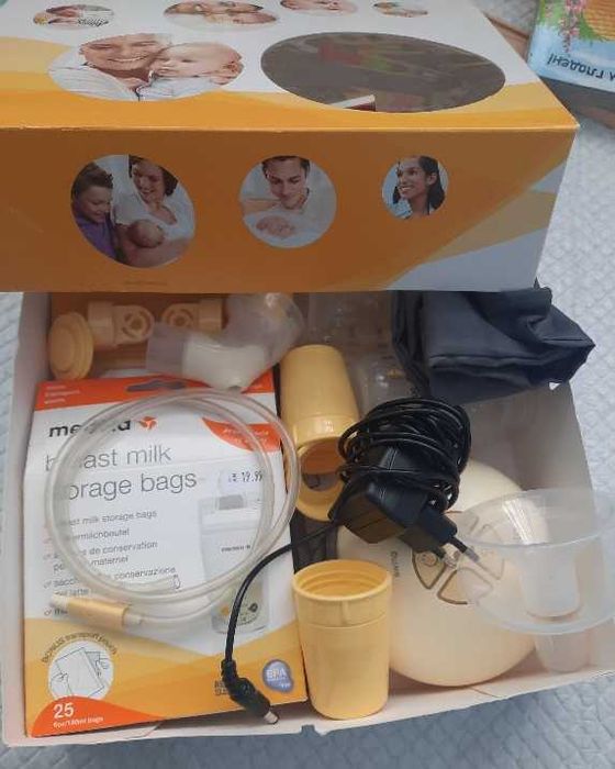 Ел. помпа за кърма Medela + торбички за кърма + резервни клапи