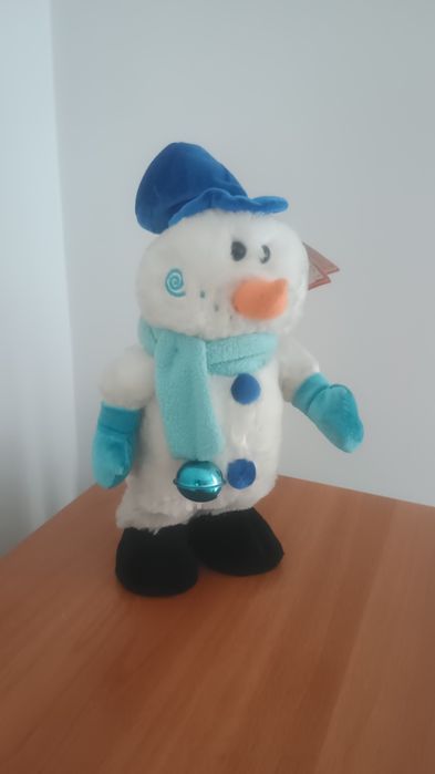 Jucărie -Om de zapada- dansează și cântă.