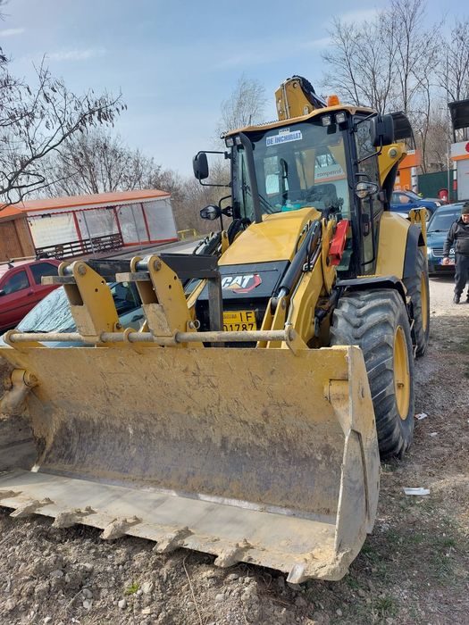 Buldoexcavator CAT NOU de inchiriat