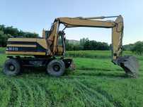 Excavator pe roti Caterpillar