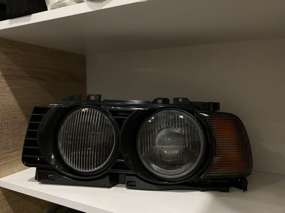 Фара Hella black BMW E34