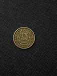 One shilling moneda