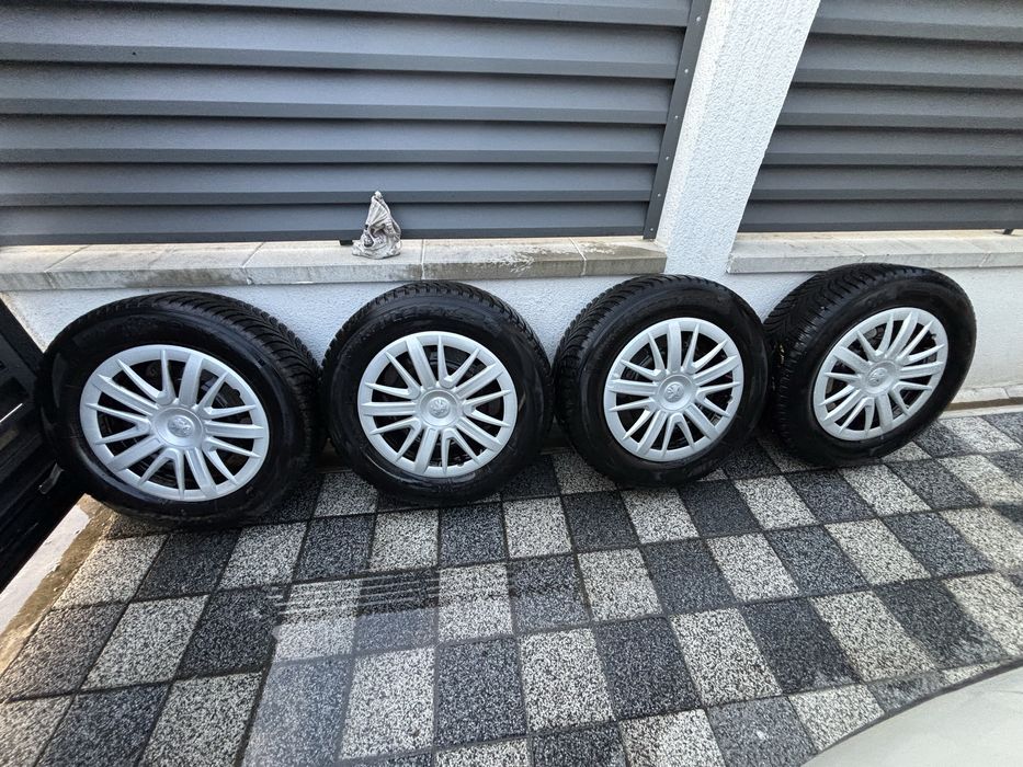 Vând set 4 roti Peugeot cu anvelope de iarna+capace+prezoane