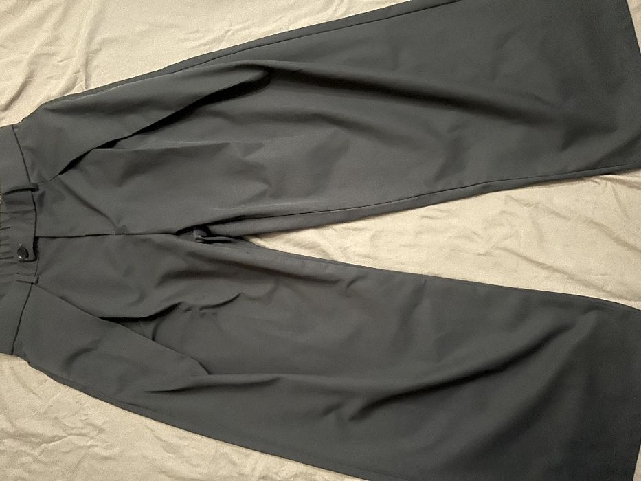 Широкие брюки с защипами