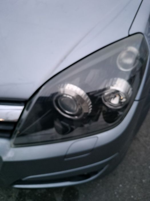 Vând faruri  Xenon Opel Astra H,Zafira B