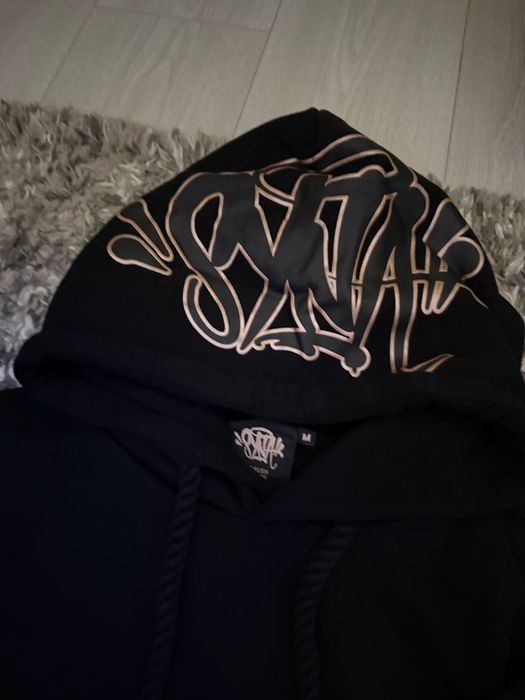 Худита syna world