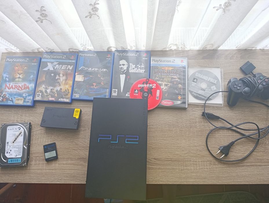 PS2 cu 7 jocuri, o maneta si un hard drive