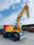 Excavator Liebherr A 311 pe roti Cupa + Greifer -Import Germania