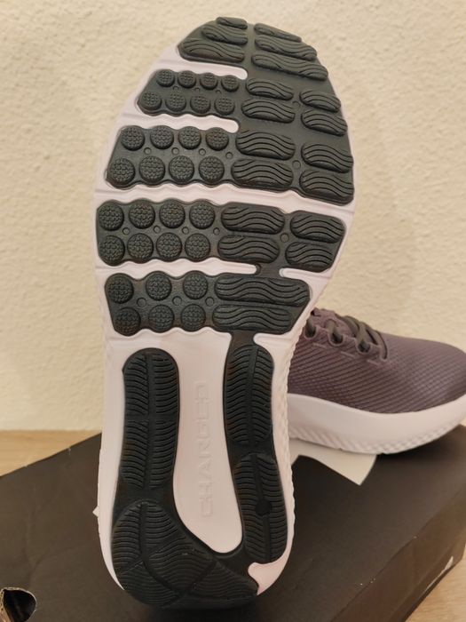 Under Armour model Charged Surge 4