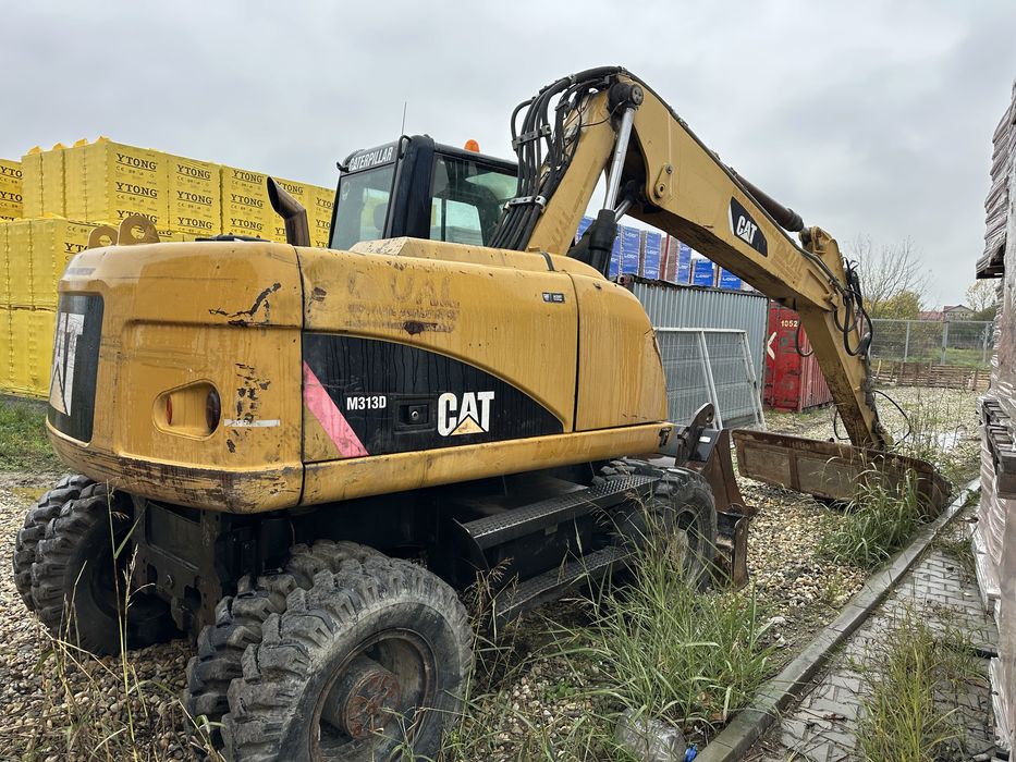 Vand excavator pe pneuri Cat M313D