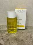 Стягащо олио за тяло Clarins