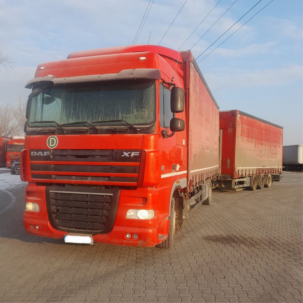 Camioane DAF XF tandem remorci Schmitz