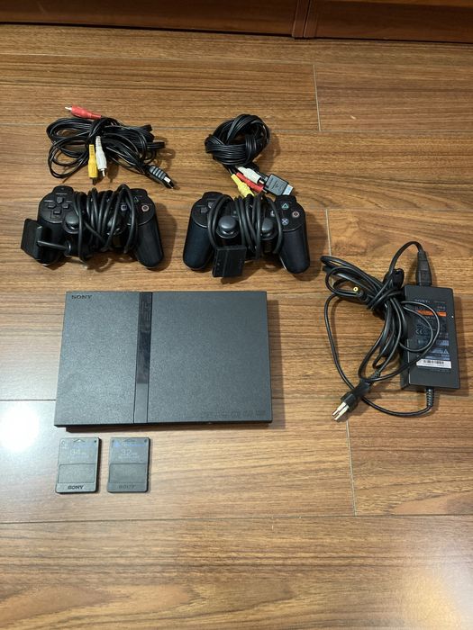 Sony PS Slim 2 + 23 диска с играми