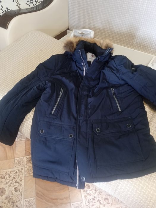 Продам мужские пуховик отличном состоянии фирменная .