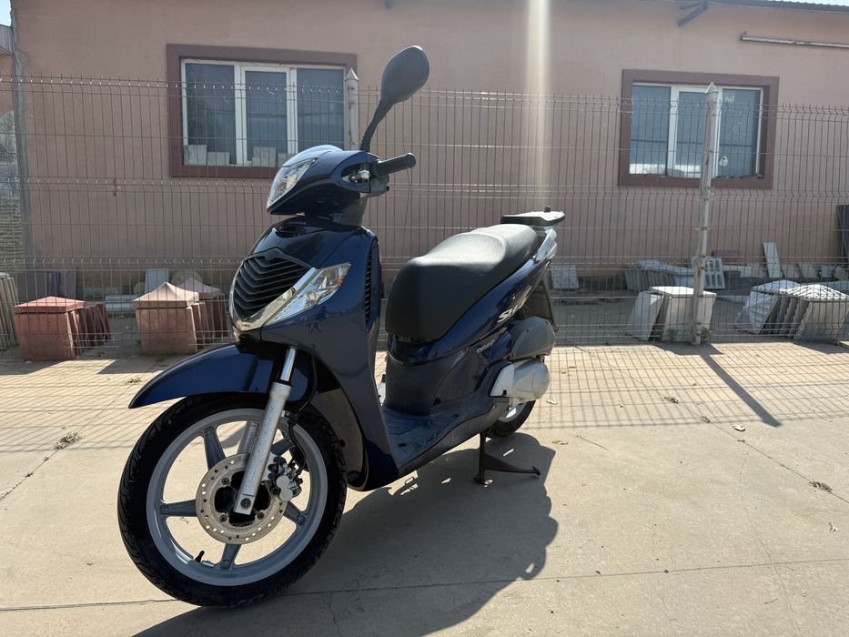 Honda sh 125i se conduce cu categoria B