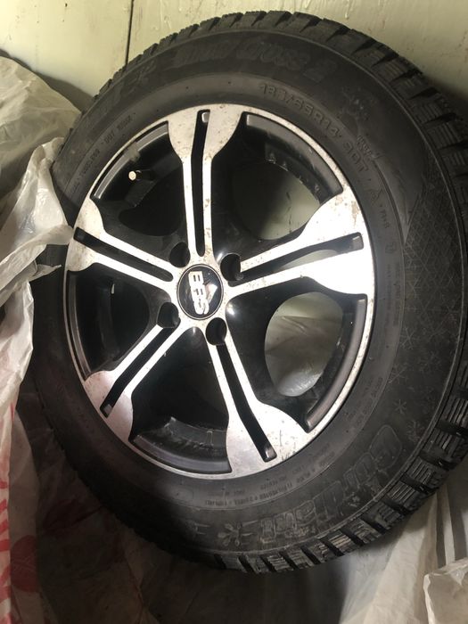 Продам зимние шипованые шины с дисками 185/65/14