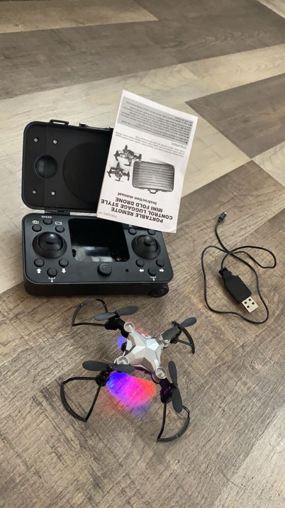 Portable remote control luggage style mini fold drone + camera