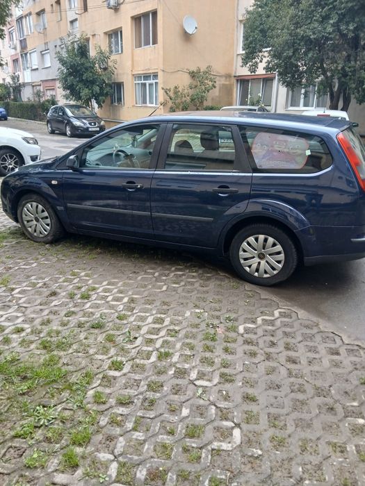 Ford focus 2 sau Dacia Logan