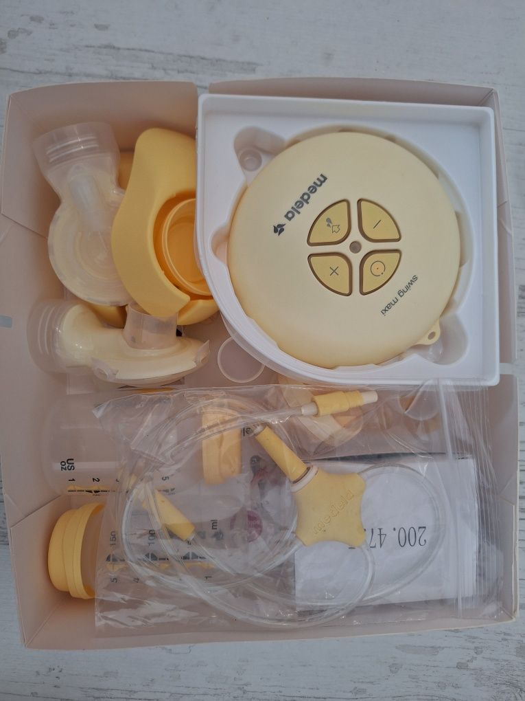 Помпа Medela swing maxi and calma