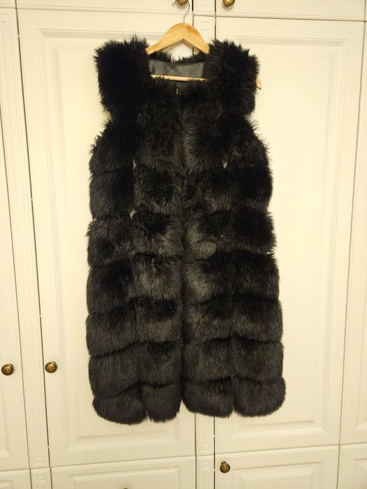 Vesta blana artificiala