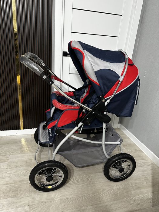 Новая зимняя коляска в целофане