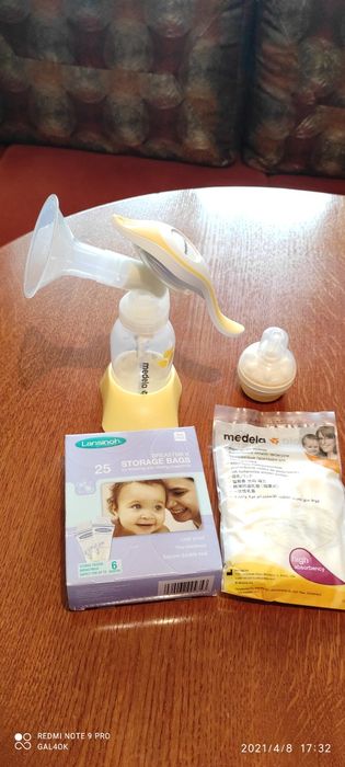 Ръчна двуфазна помпа за кърма Medela harmony .