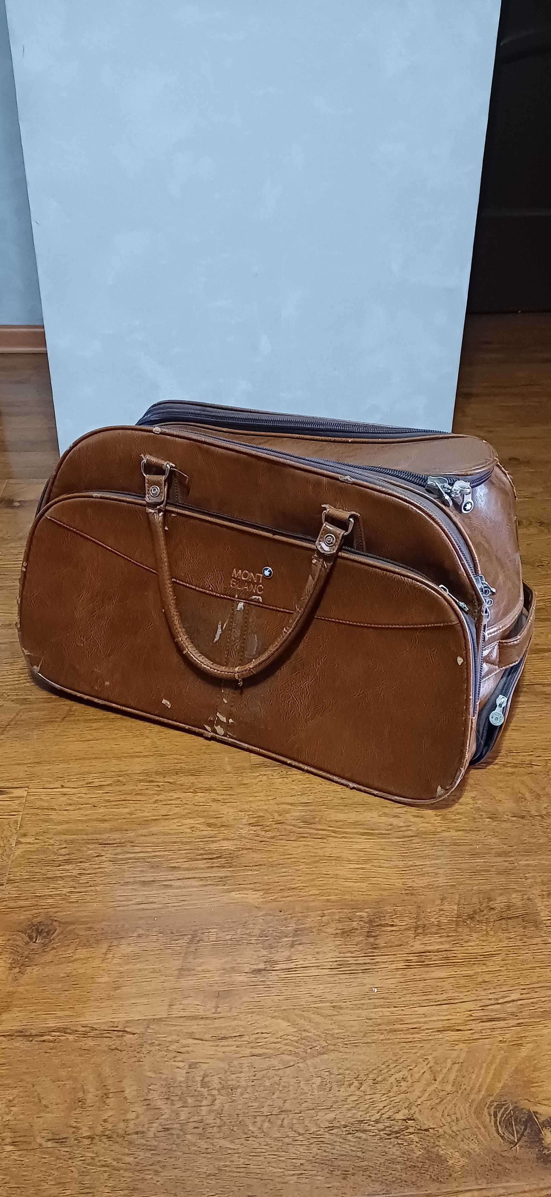 Кожаный чемодан-сумка на колесиках в хорошем состоянии