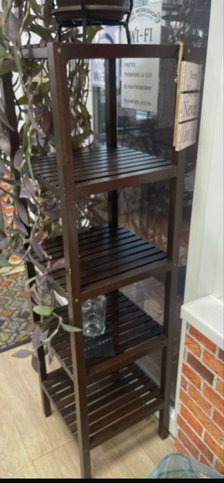 IKEA MUSKAN shelving unit in dark brown.