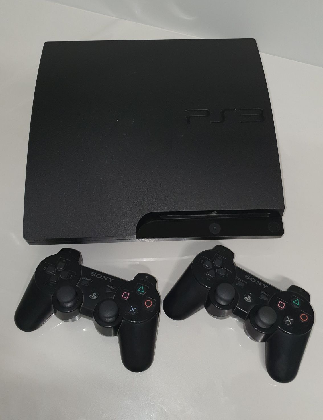 Продаётся PlayStation 3 slim + 8 оригинальных игр