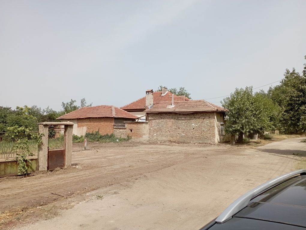 Услуги с багер и самосвал събаряне на сгради , почистване на ниви Баге